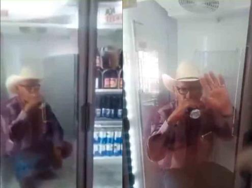 (+Vídeo) Hombre se mete al refri a echarse su cervecita por el calor