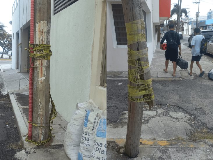 Peligro por postes de CFE y Telmex a punto de caer en callejón